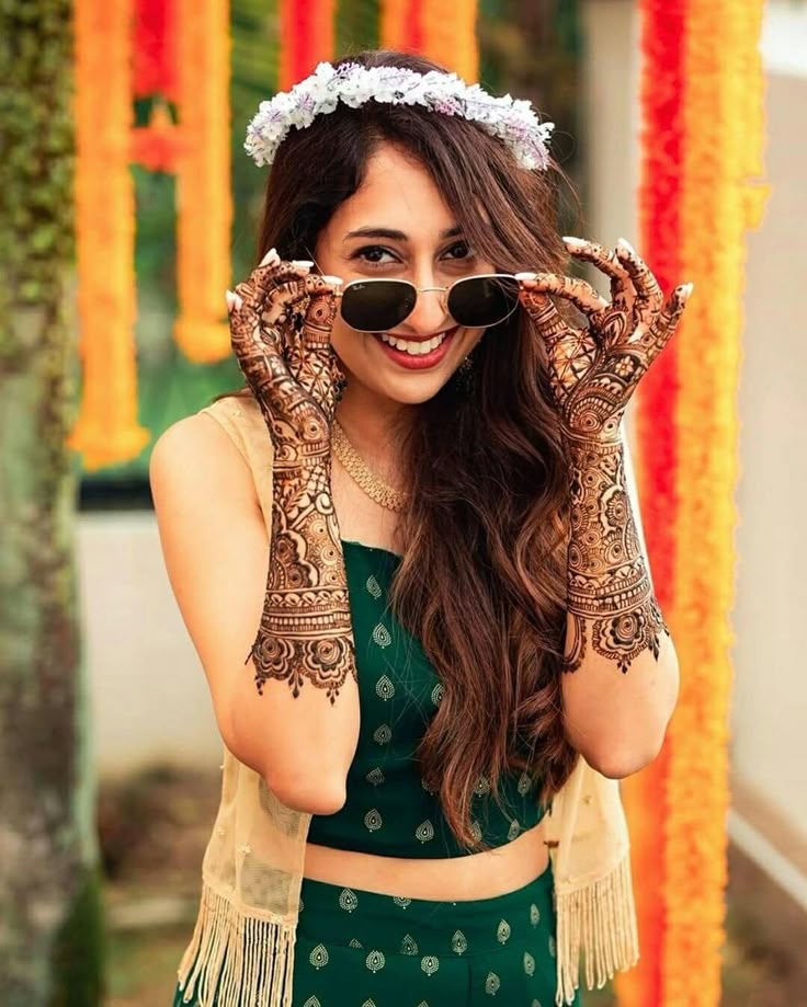 Happy Indian bride at her mehndi function_